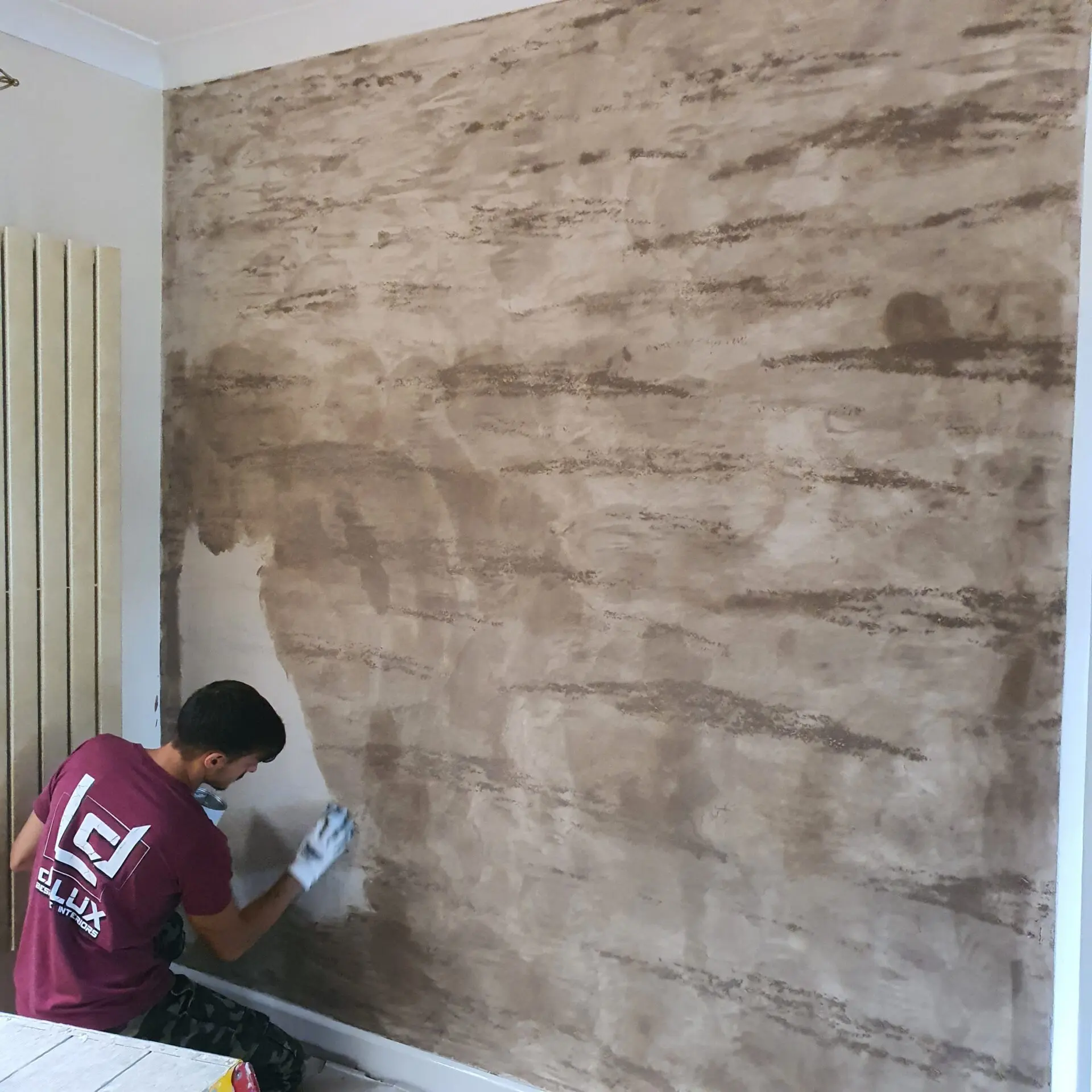Third coat of venetian plaster. Application of cera wax